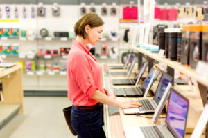 woman chooses the laptop